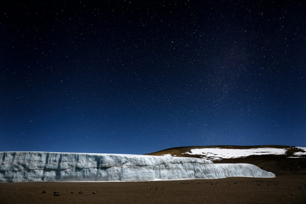 white and brown mountain under starry night